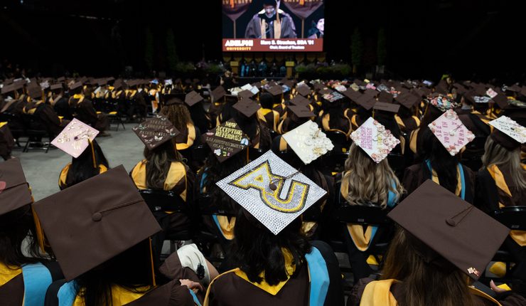 Commencement at Adelphi - showing a crowd of graduates