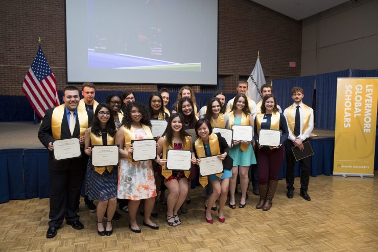 LGS students holding award certificates.