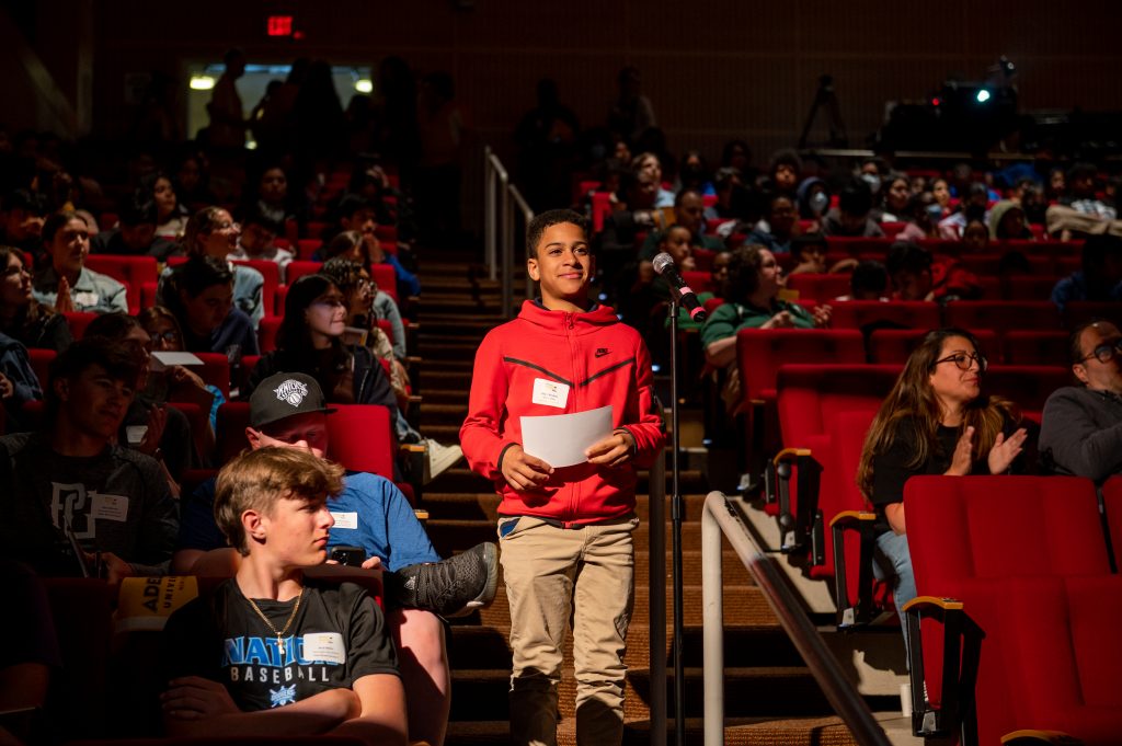 A middle school student asks a question at Adelphi University's College Awareness Day.