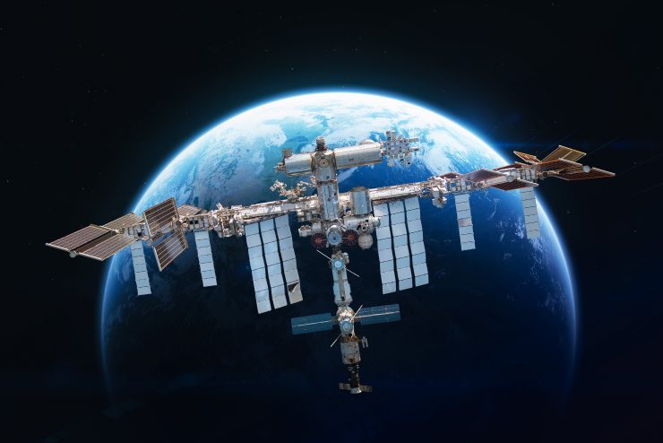 International space station in 2022 on orbit of Earth planet. ISS with astronauts in outer space on orbit. View on surface of planet. Elements of this image furnished by NASA