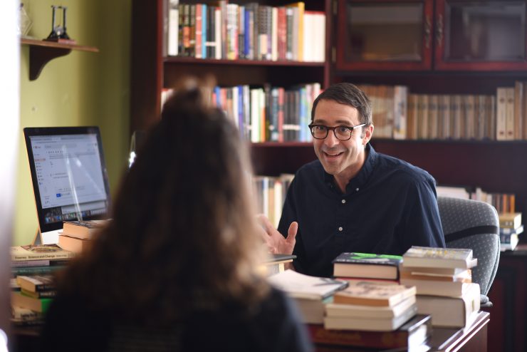 Professor Craig Carson speaking with a student