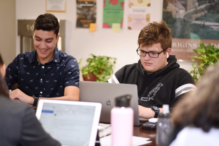 Honors students working on laptops in Earle Hall at Adelphi