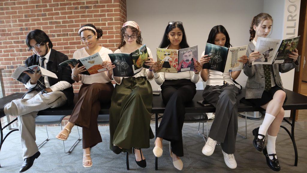 Group photo of the 2026-27 Honors Council Board reading New Yorker Magazines.