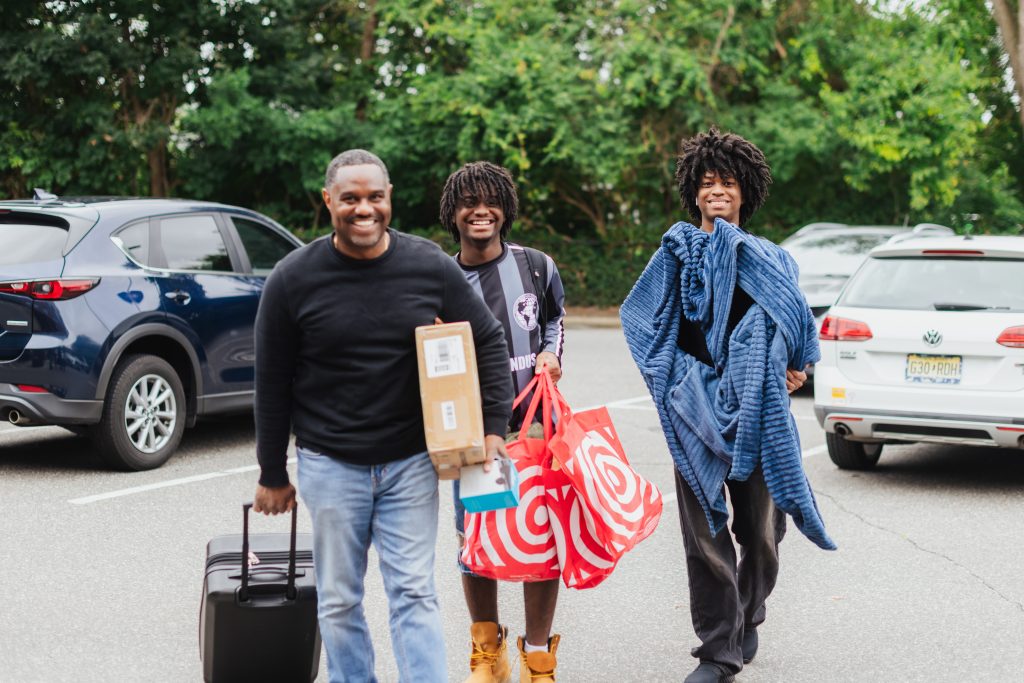 Adelphi family moving their child into the dorms on campus.