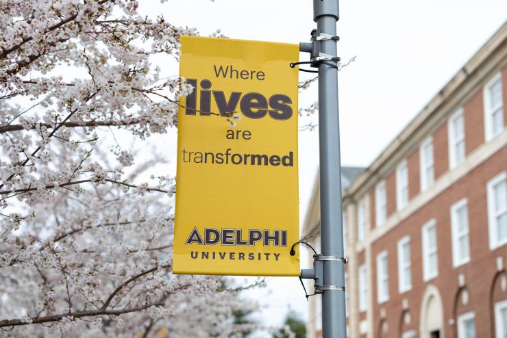 Where lives are transformed - sign at Adelphi
