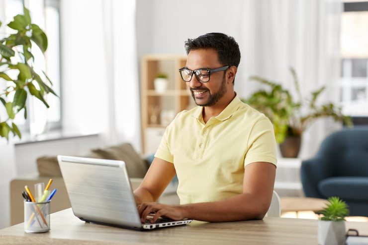 An employee successfully working in a home office.