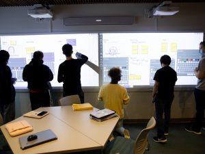 Students standing in Adelphi's Innovation Center