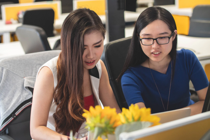 Two students at a computer during OPT training