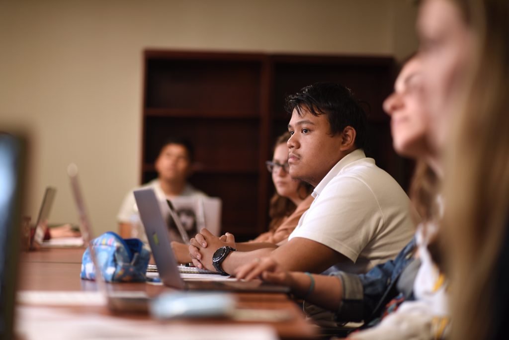 Adelphi students studying in an honors college classroom