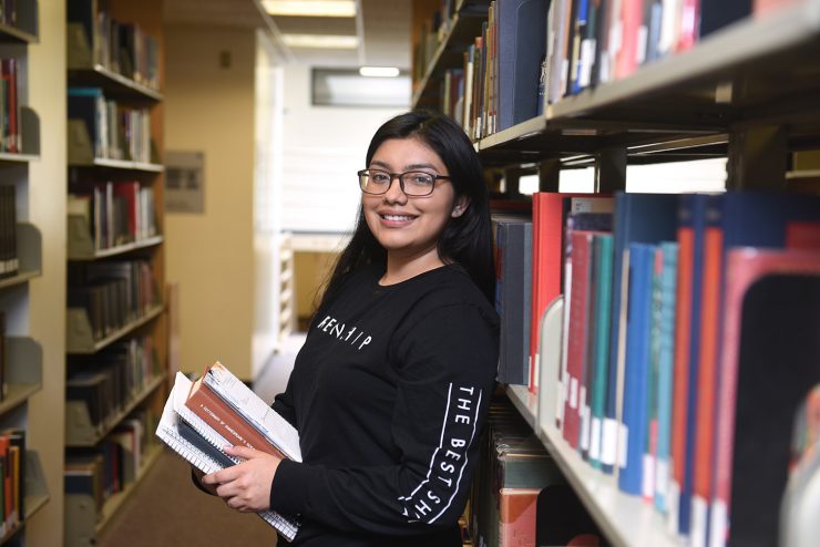 Student in the Swirbul Book Stacks
