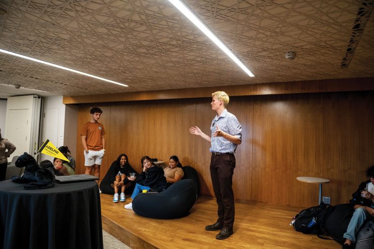Robby Fahrenholtz (they/them) speaking in the new Multicultural Center at Adelphi's UC