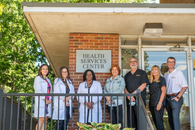 Health Services staff in front of the Waldo Hall entrance