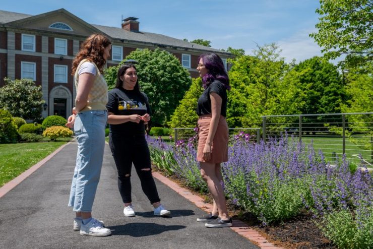 Students walking on campus in the summertime