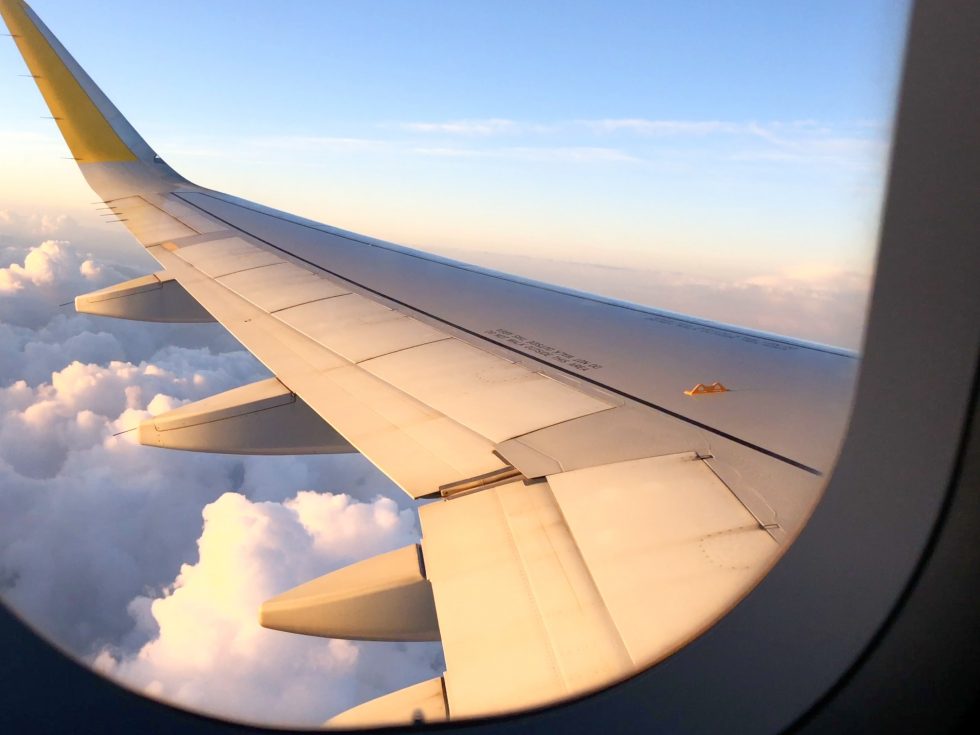 The view from within an airplane looking out on the wing.