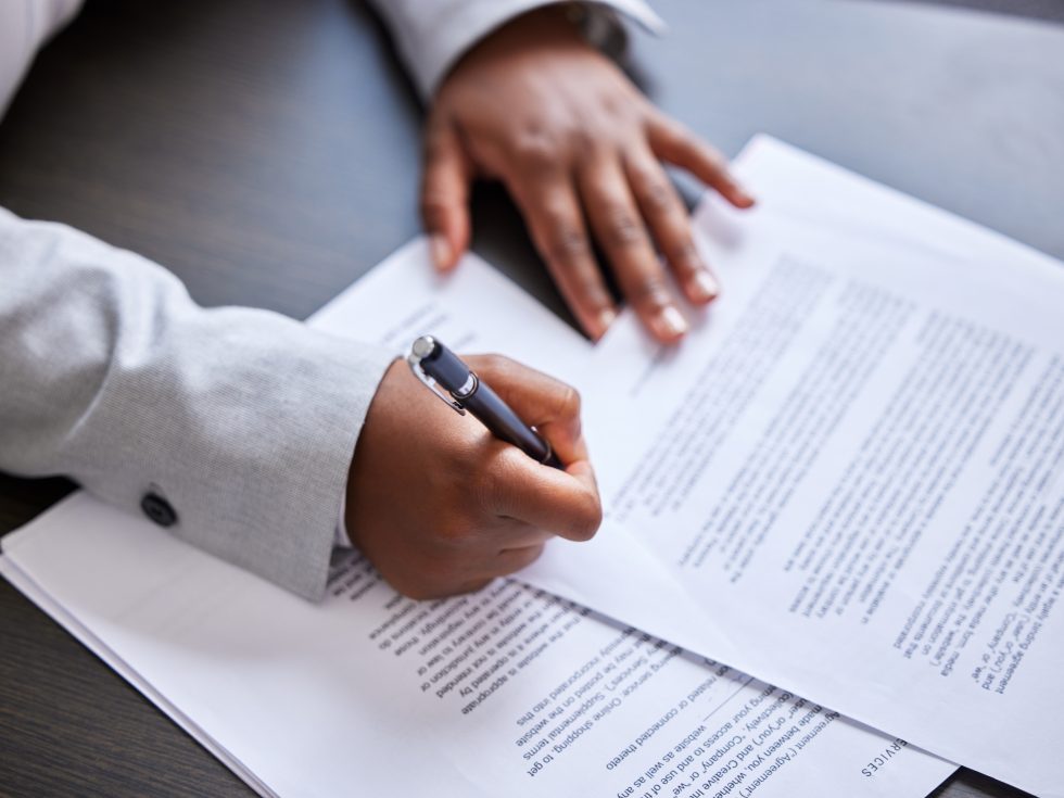 Signing contracts close up.