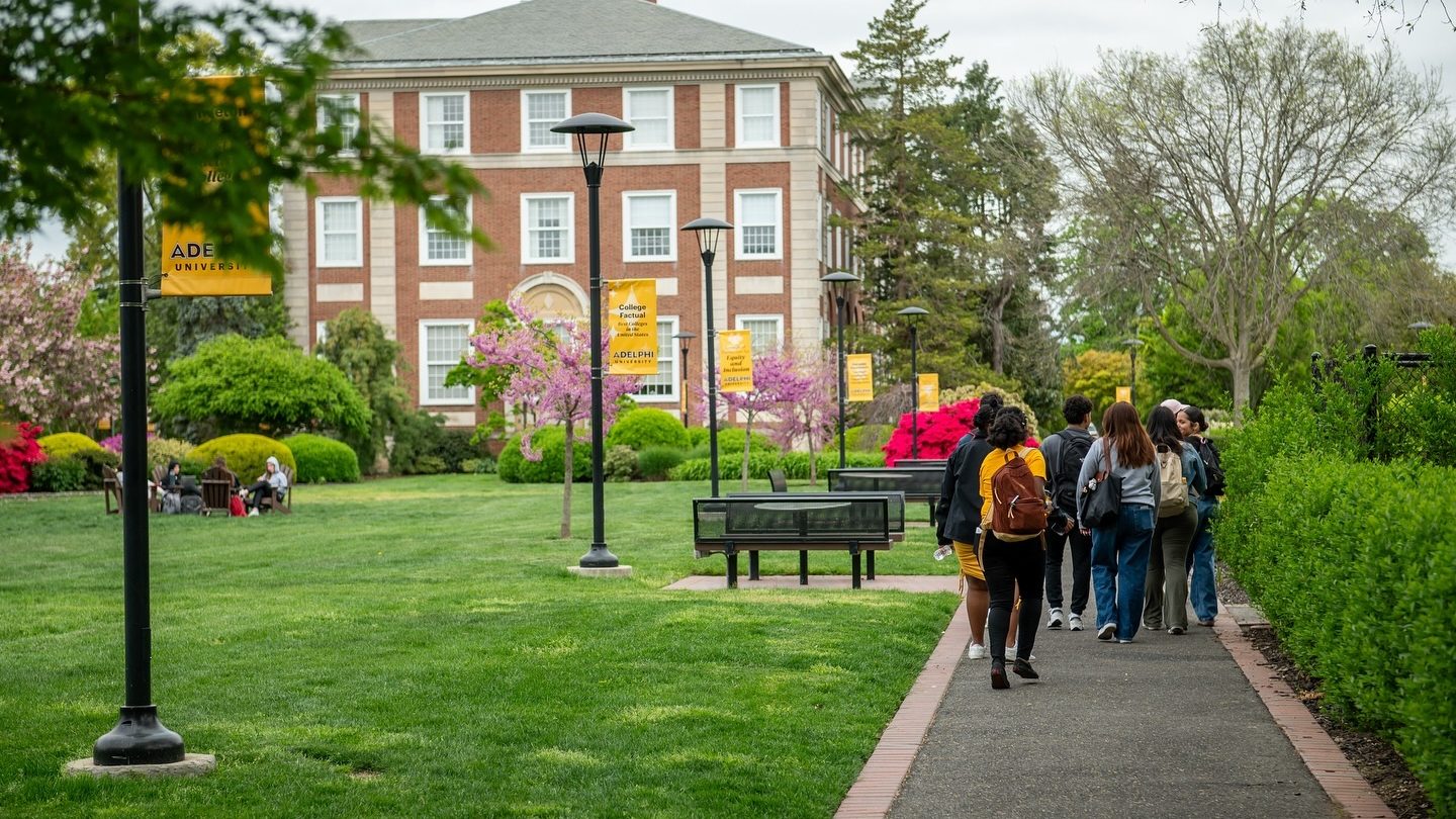 People walking the paths at Adelphi University's beautiful Garden City NY campus
