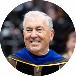 Michael Balboni walking at Adelphi Commencement