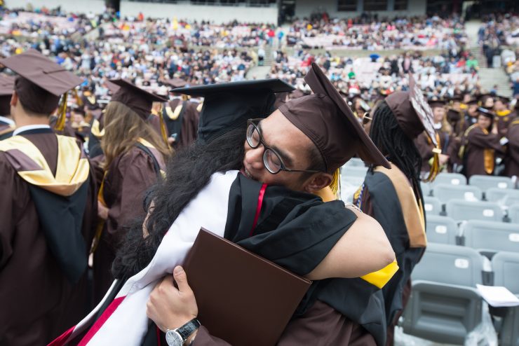 A warm hug during commencement at Adelphi University