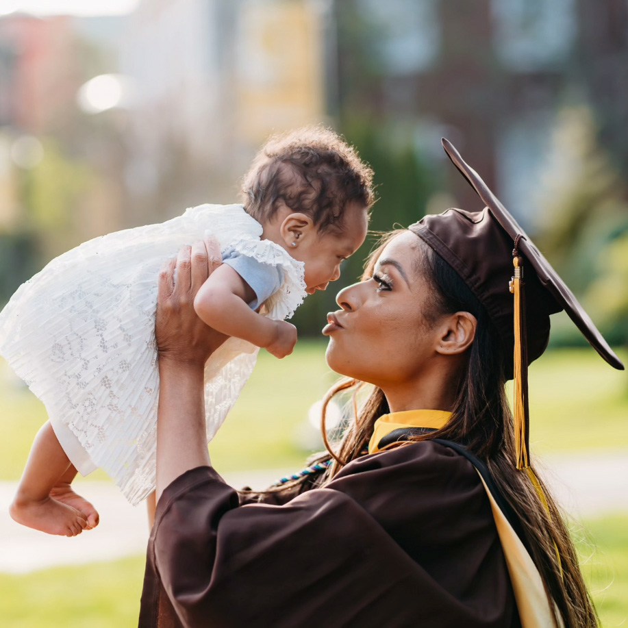 RoeMechia John ‘22 and her beautiful child Nia celebrate her graduation from Adelphi University.