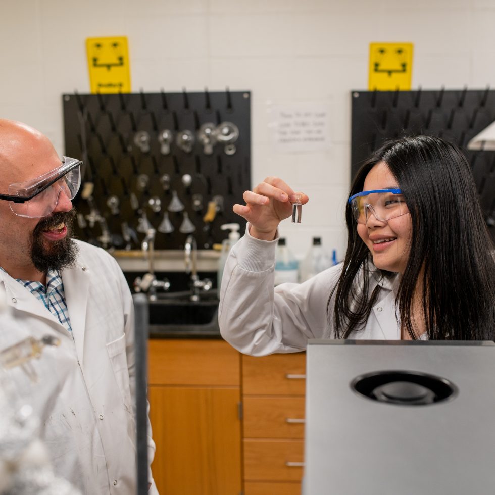 Student working with a faculty member in a lab.