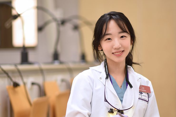 Student in a wghite lab coat