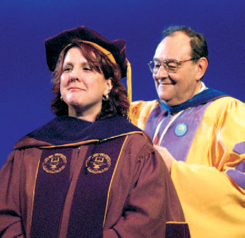 Dr. George Stricker hooding a psychology doctorate student at Adelphi University