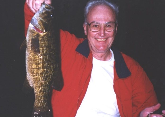 Patrick Ross holding up a large fish