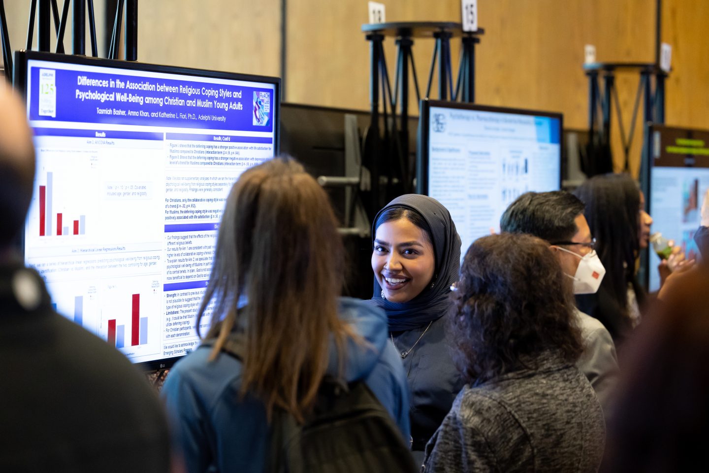 Research Day 2022 - a student research in front of her e-poster