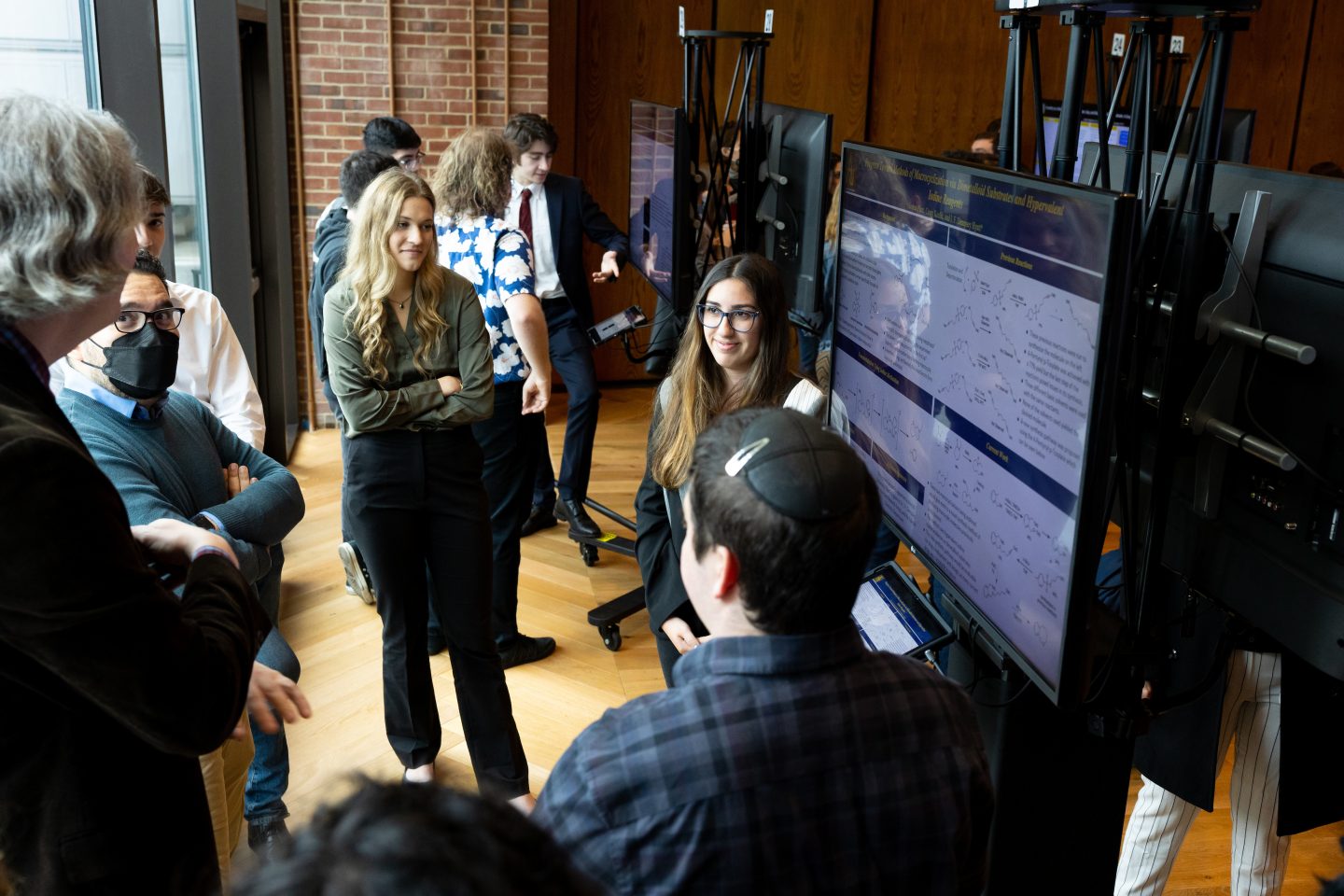 Research Day 2022 - a group of student researchers in front of an e-poster