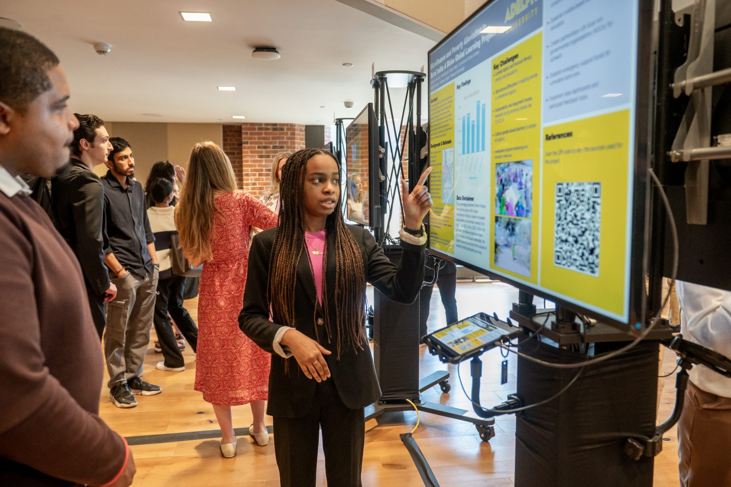 Candice Garwood, a student in Adelphi’s Levermore Global Scholars program and Adelphi’s seventh Newman Fellow, presents her research on ways to reduce poverty for women in rural India.