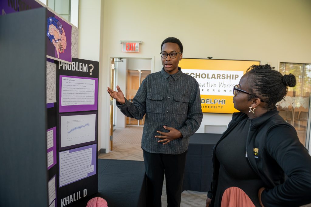 High school junior presents his work at Adelphi University's annual conference for a chance to win a full-tuition scholarship.