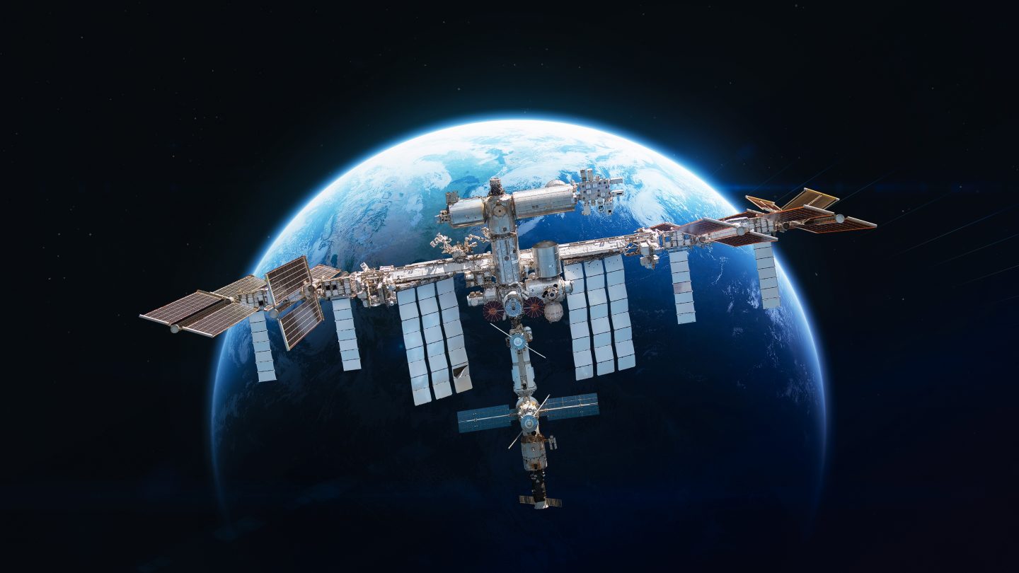 International space station in 2022 on orbit of Earth planet. ISS with astronauts in outer space on orbit. View on surface of planet. Elements of this image furnished by NASA