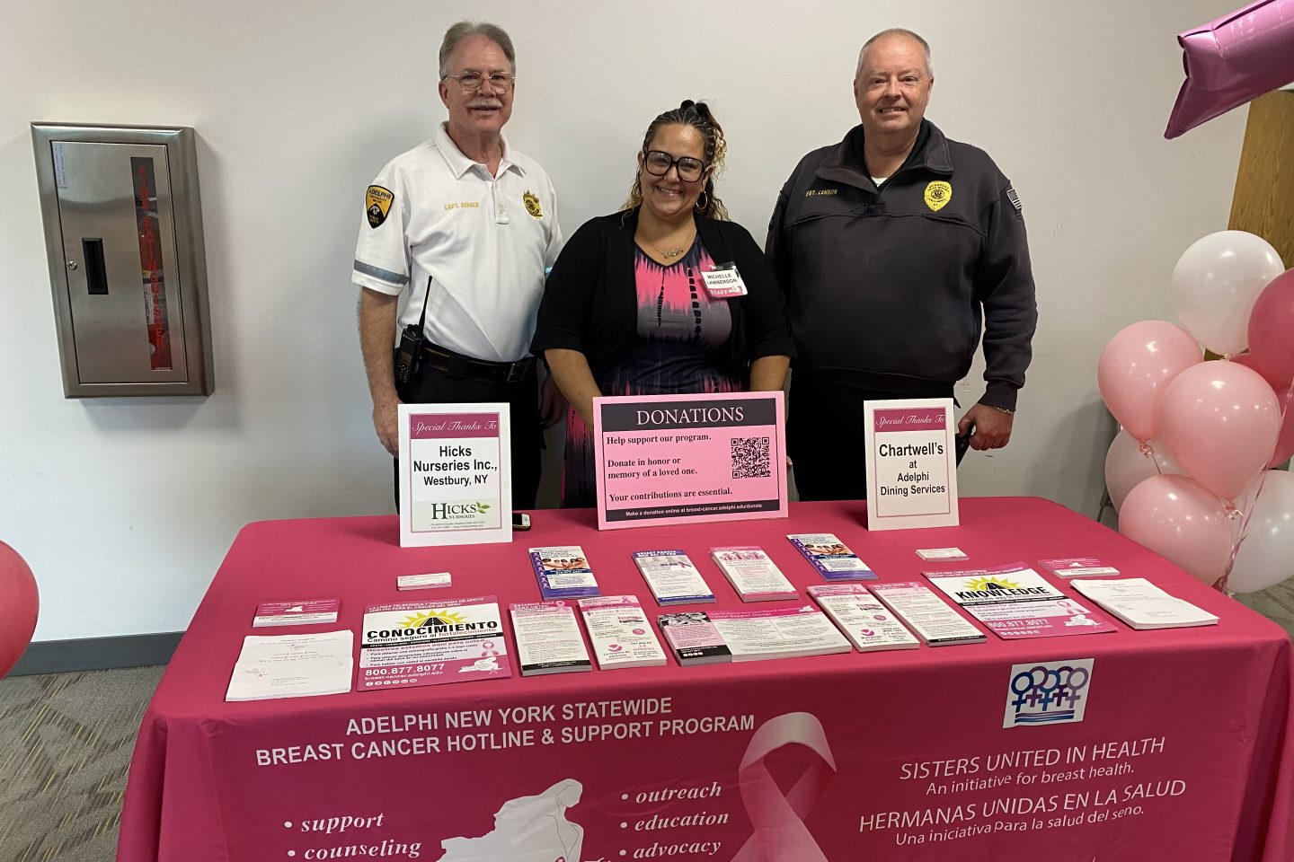 Michelle Lamberson (middle), from the Adelphi NY State Breast Cancer Hotline and Captain Stephan Berger (left) on Sergeant Gerry Lennon (right) of the Department of Public Safety and Transportation.
