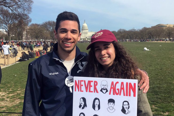 Adelphi students holding AAPI Justice signs in Washington DC