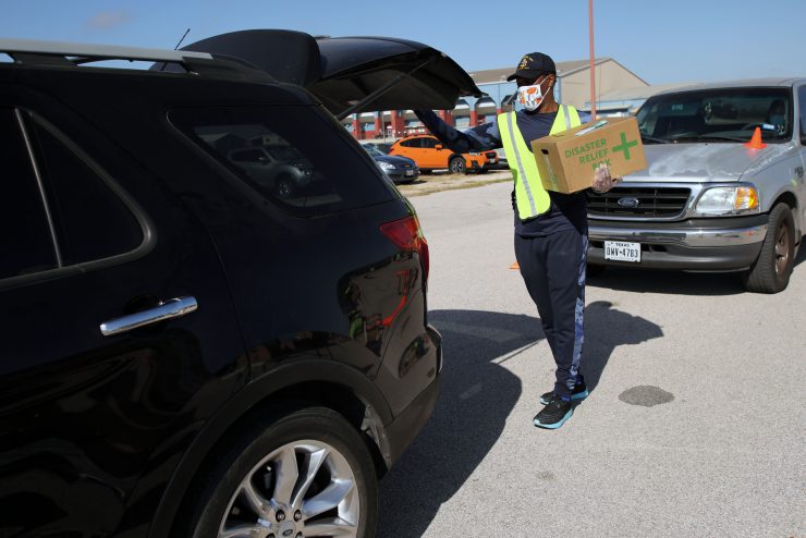 A volunteer wearing a reflective vest during disaster recovery.