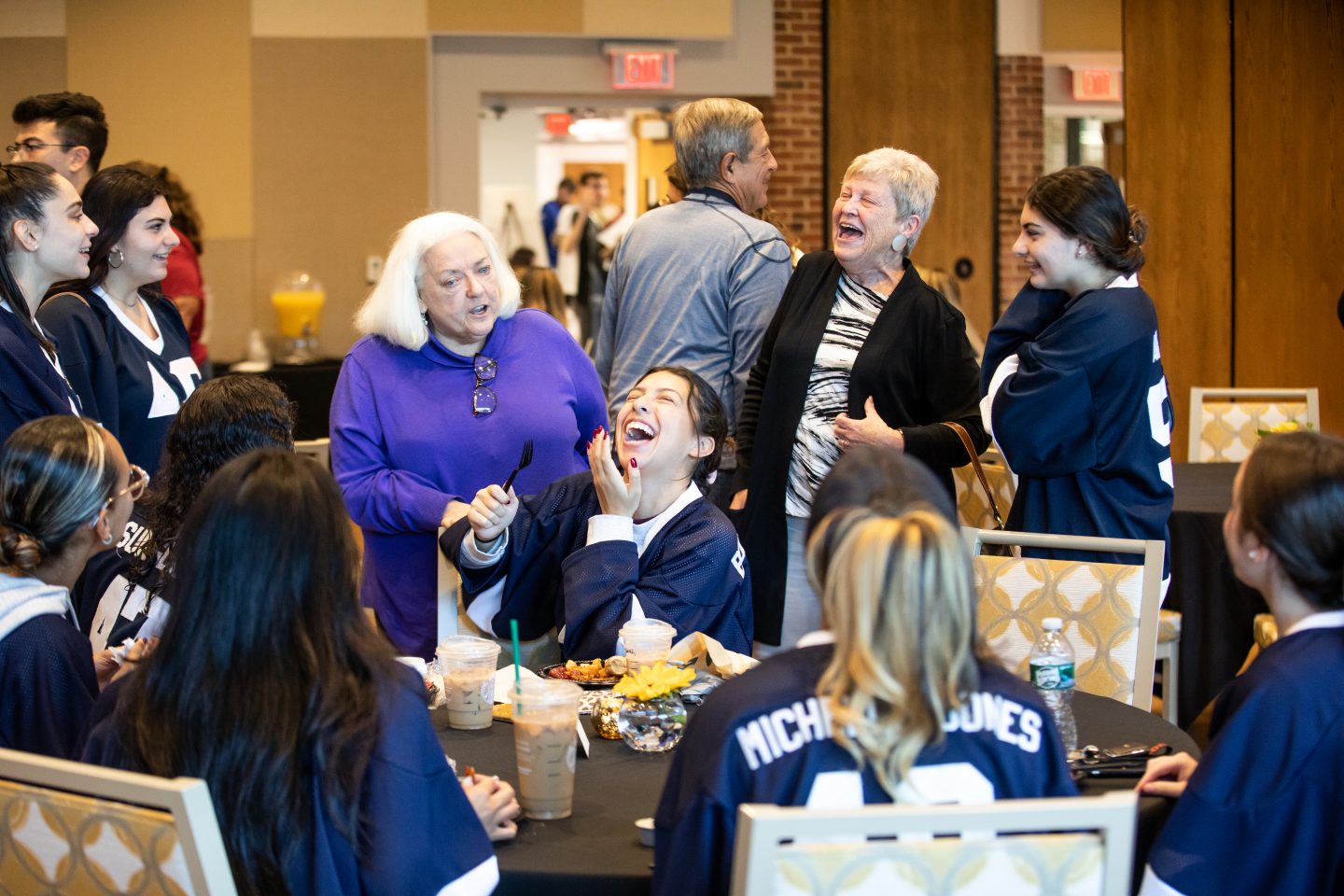 Sisters share a laugh with alumni at the Greek Letters Lunch