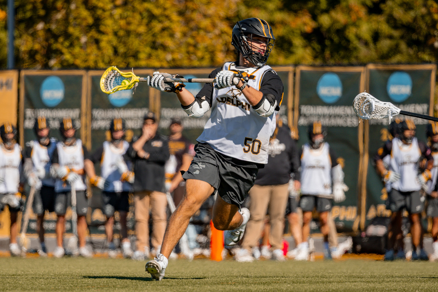 A male lacrosse player showing incredible skills and athleticism