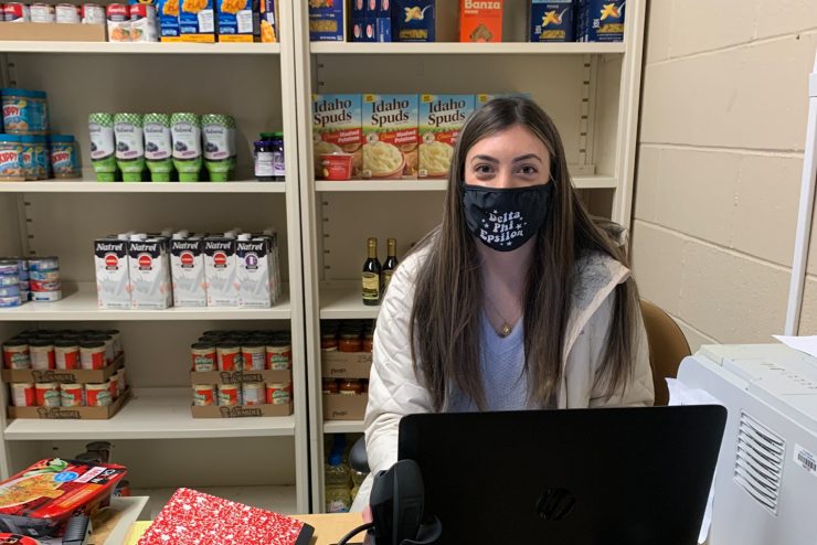 Student staffer at Adelphi's community pantry
