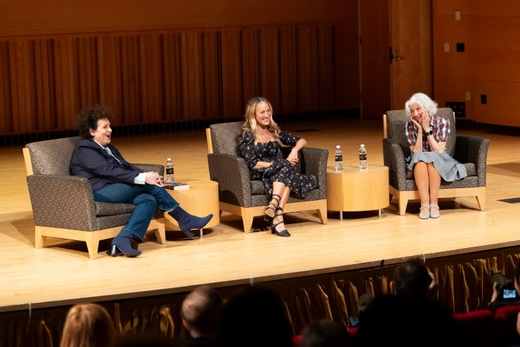 Three women sitting in chairs 