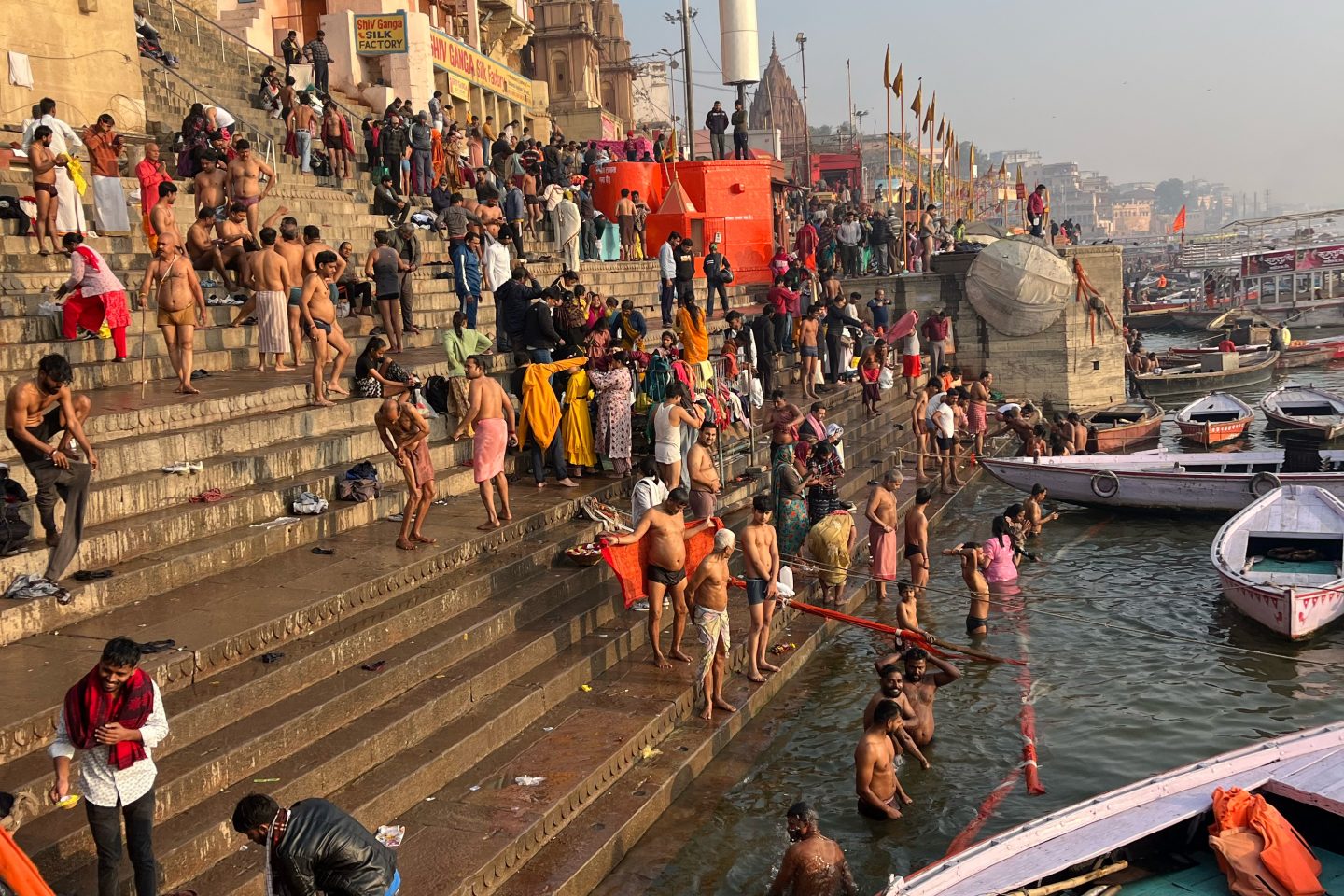 Adelphi students observe pilgrims in Varanasi, witnessing sacred rituals along the Ganges River, including ritual bathing in its waters as an expression of faith and spiritual renewal.