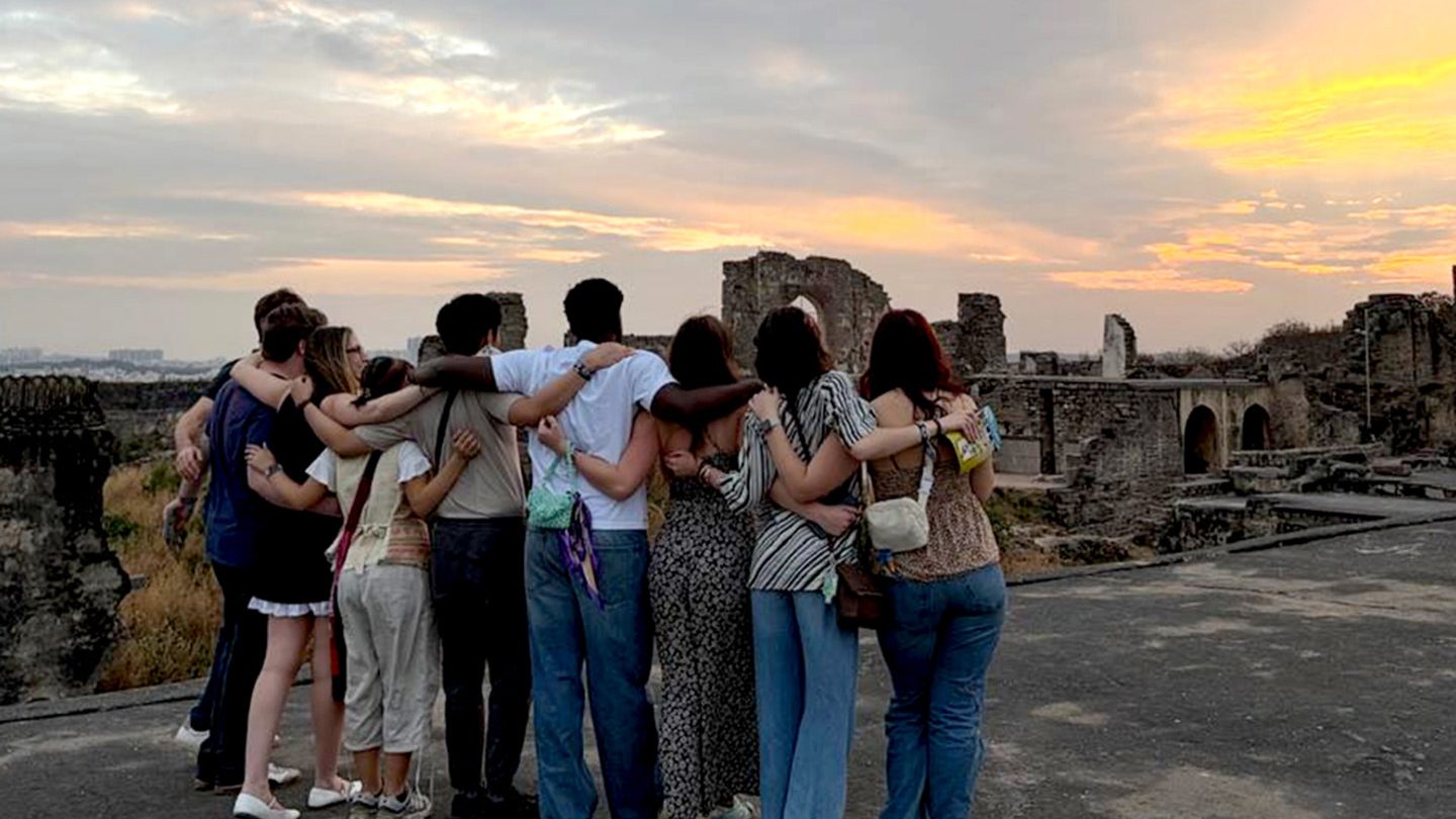 Adelphi Students traveled to India for and unforgettable experience. Students watch sunset in Hyderabad together.