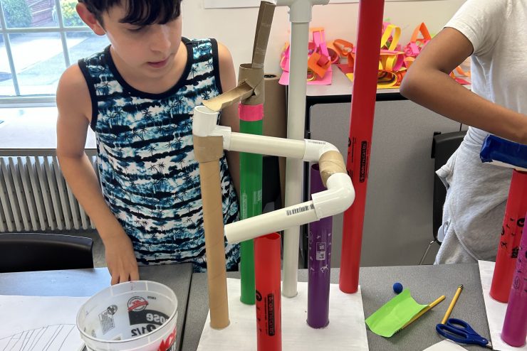 Adelphi enrichment summer camps: STEM exploration building marble runs.