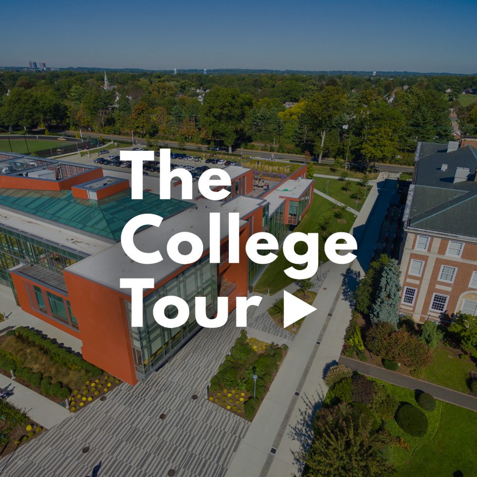 The College Tour at Adelphi University: Show Logo overlaid over an aerial view of Adelphi University's Garden City Campus
