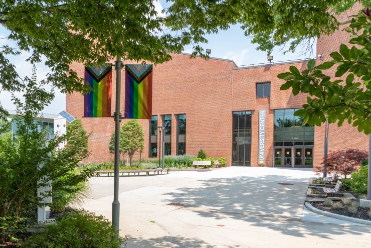 Adelphi University Center with pride flag out front.