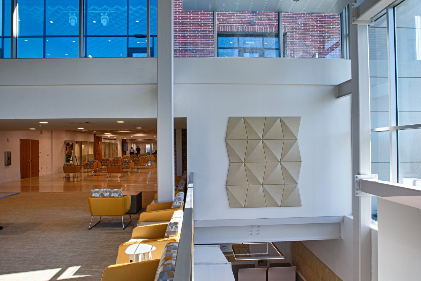 Acoustic panel and seating on the wall in the UC main lobby