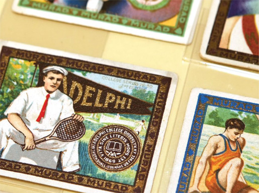 An Adelphi trading card among ones from other colleges that were sold with Murad Cigarettes, starting in 1914