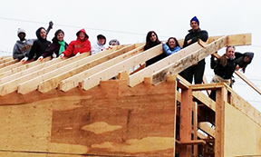 Adelphi student work with Habitat For Humanity