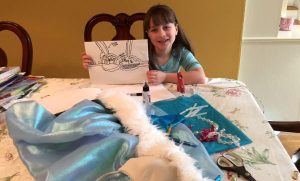 Sienna Leaver shows off her bra design for the Creative Cups Auction at Adelphi University