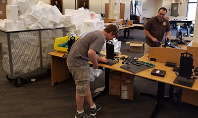 Endpoint Technicians installing new computers during the renovation.