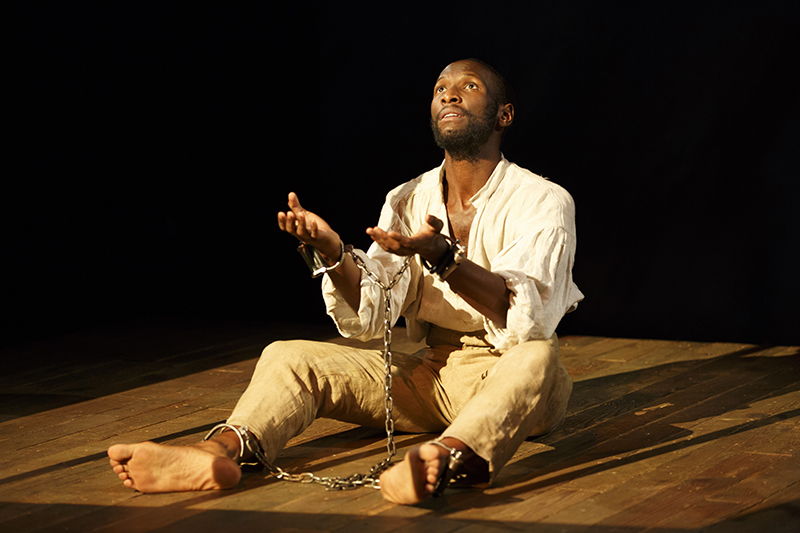 Nat Turner in Jerusalem NYTW By Nathan Alan Davis Directed by Megan Sandberg-Zakian Scenic Design by Susan Zeeman Rogers Costume Design by Montana Blanco Lighting Design by Mary Louise Geiger Sound Design by Nathan Leigh Fight Direction by Thomas Schall Dialect Coach Dawn-Elin Fraser Stage Manager Shelley Miles Featuring Phillip James Brannon and Rowan Vickers